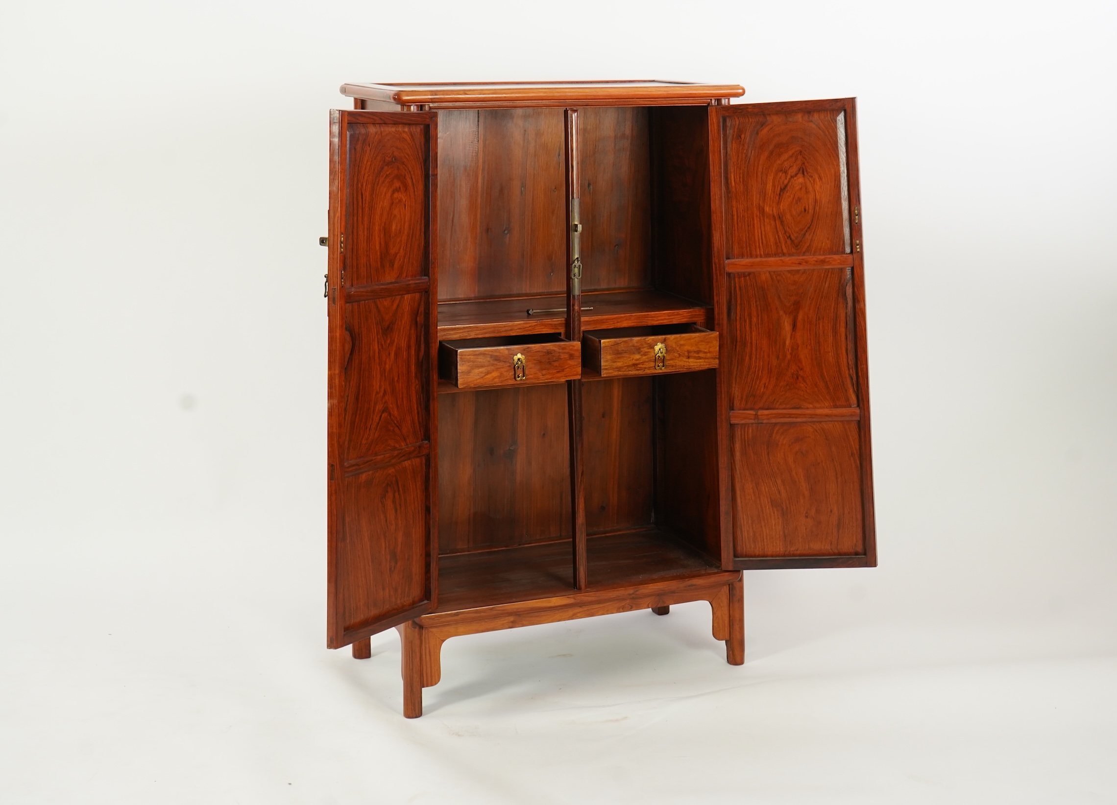 A Chinese huanghuali round-corner cabinet, yuanjiaogui, 19th/20th century